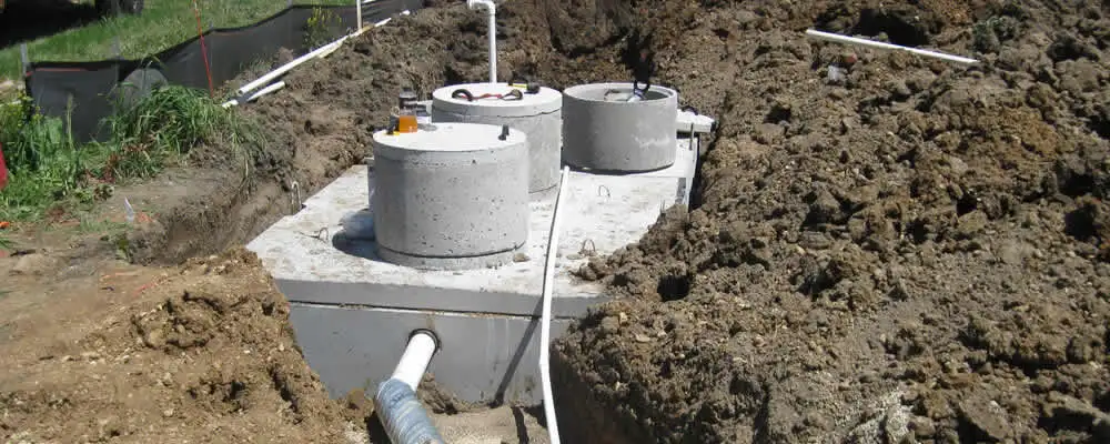 Septic system repair and installation site with tank access ports in Green Bay, WI