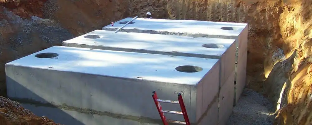 Septic tank installation site with a newly placed concrete tank in Green Bay, WI